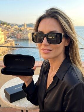 Linda Farrow Black Case with Gold Lettering / very good condition.